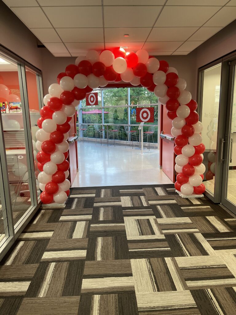 A red and white balloon arch.